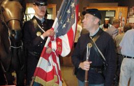 A reenactor eyes his stone-faced counterpart in the special exhibit Minnesota's Two Civil Wars.