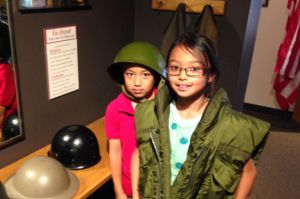 Kids enjoy a special corner of the museum where they can try on various uniforms and equipment.