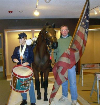 Construction proceeds on a special exhibit on the Civil War, scheduled to open summer 2011. Shown here is curator Doug Bekke and friends.