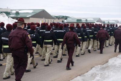 Minnesota State Patrol cadre and candidates of the Trooper Academy march between classes, Feb. 2016.  Camp Ripley is widely used by law enforcement agencies.